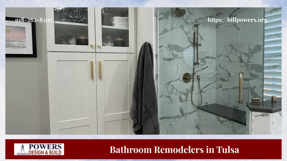 Tulsa bathroom remodel with marble shower, glass doors, and modern storage.