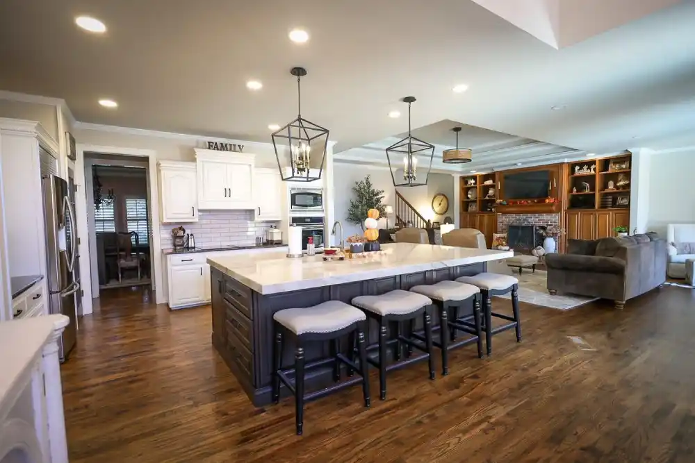 Open-concept Tulsa remodel with custom kitchen island and pendant lighting