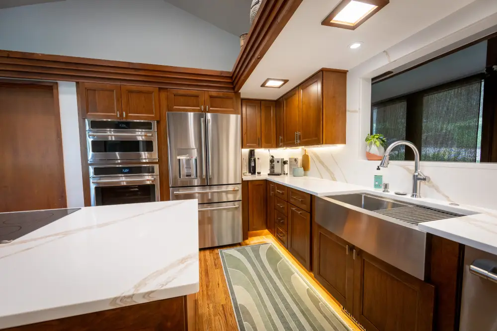 Modern Tulsa kitchen with warm wood cabinets and hidden storage